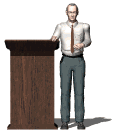 man speaking next to a podium